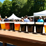 수제맥주 브랜드의 역사 - **A wide selection of diverse craft beers displayed on a wooden table at an outdoor beer festival, f...